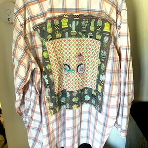 Three XL orange and blue button-down shirt with bicycle patch on the back